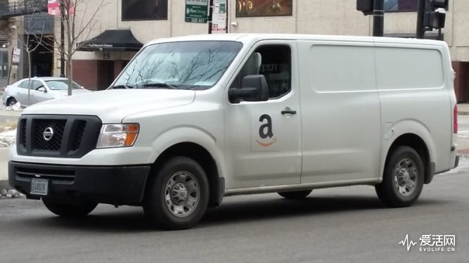 view-of-a-white-delivery-van-or-truck-with-an-amazon-logo-on-its-side-picture-id599433087