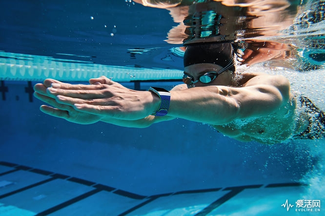 Lifestyle photo of Caucasian Male Swimming Outdoors with Ionic Cobalt/Lime Sport Band