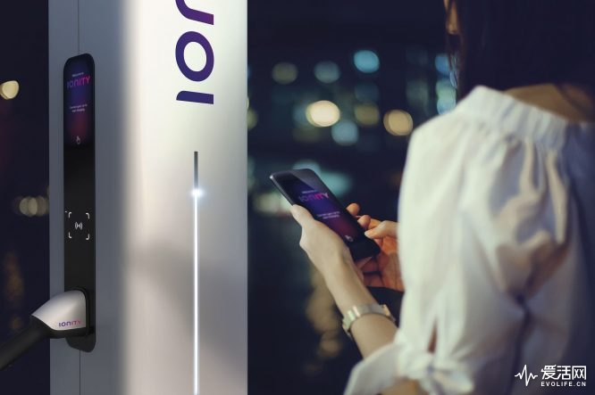 Woman using smartphone on the street at night