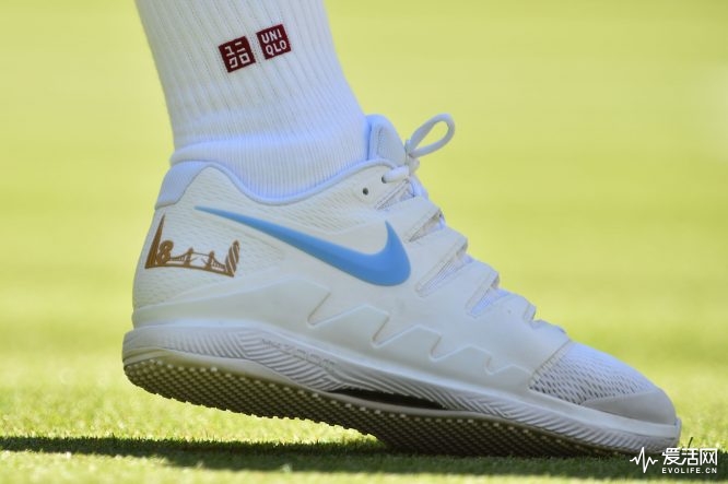 Switzerland's Roger Federer wears a pair of customised tennis shoes with an outline of the London skyline and the number of Wimbledon titles as he plays Serbia's Dusan Lajovic during their men's singles first round match on the first day of the 2018 Wimbledon Championships at The All England Lawn Tennis Club in Wimbledon, southwest London, on July 2, 2018. (Photo by Glyn KIRK / AFP) / RESTRICTED TO EDITORIAL USE (Photo credit should read GLYN KIRK/AFP/Getty Images)