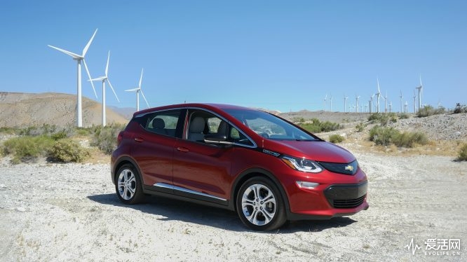 Music festival goers stop for a photo opp with their Bolt EV at iconic Indio, California stops.