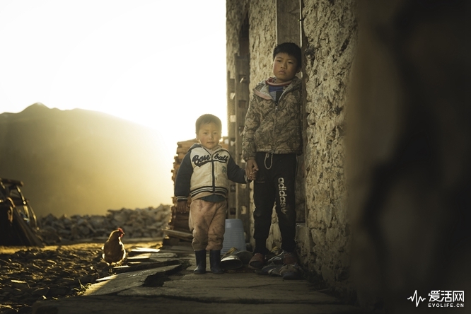 Bhutanese Brothers holding hands in a village