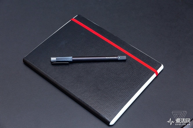 Moleskine notebook and pen